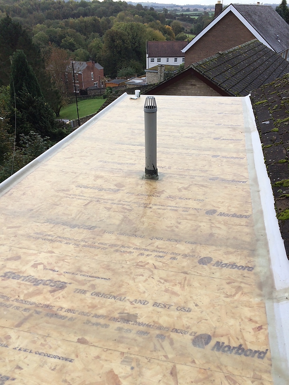 GRP Flat Roofing — Base coat and interlocking boards