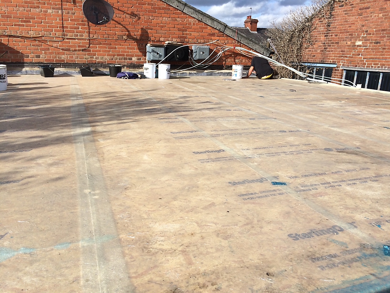 GRP Flat Roofing — Base coat and interlocking boards